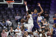 NBA G League Ignite's Scoot Henderson attempts to shoot around Boulogne-Levallois Metropolitans 92's Victor Wembanyama during the second half of an exhibition basketball game Tuesday, Oct. 4, 2022, in Henderson, Nev. (AP Photo/John Locher)