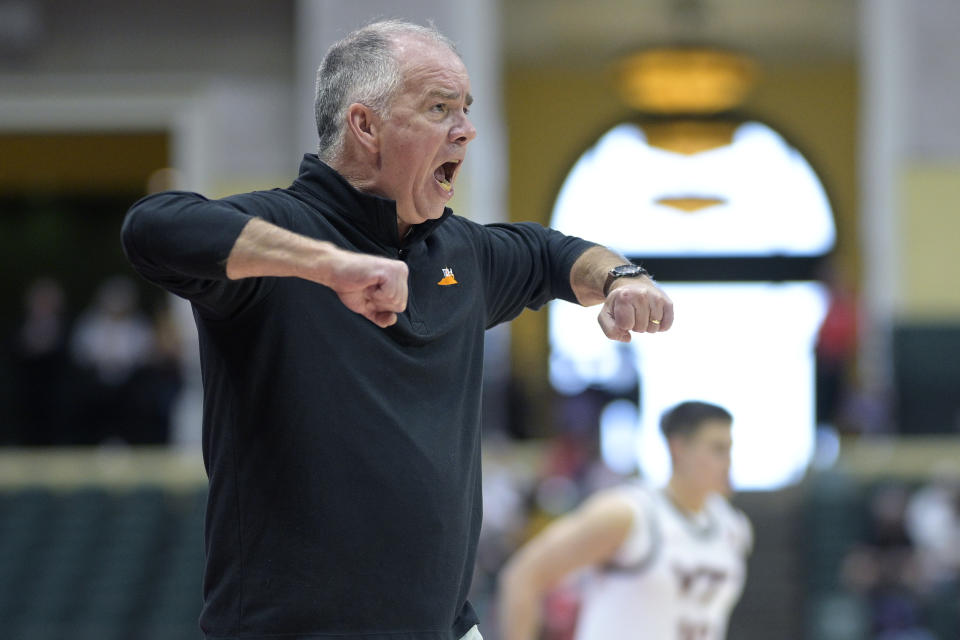 Virginia Tech head coach Mike Young calls out instructions during the first half of an NCAA college basketball game against Florida Atlantic, Sunday, Nov. 26, 2023, in Kissimmee, Fla. (AP Photo/Phelan M. Ebenhack)