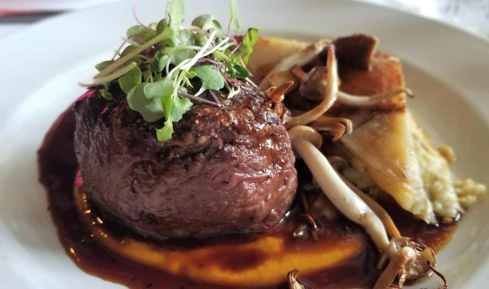 Chateaubriand with potatoes au gratin and chanterelles at The Chateau Anna Maria, which is one of our picks for best hotel restaurants in Sarasota and Manatee counties.