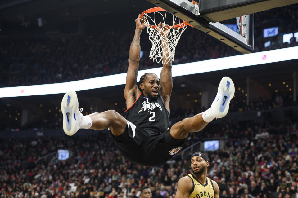 Los Angeles Clippers forward Kawhi Leonard dunks against the Toronto Raptors during the first half of an NBA basketball game Friday, Jan. 26, 2024, in Toronto. (Christopher Katsarov/The Canadian Press via AP)