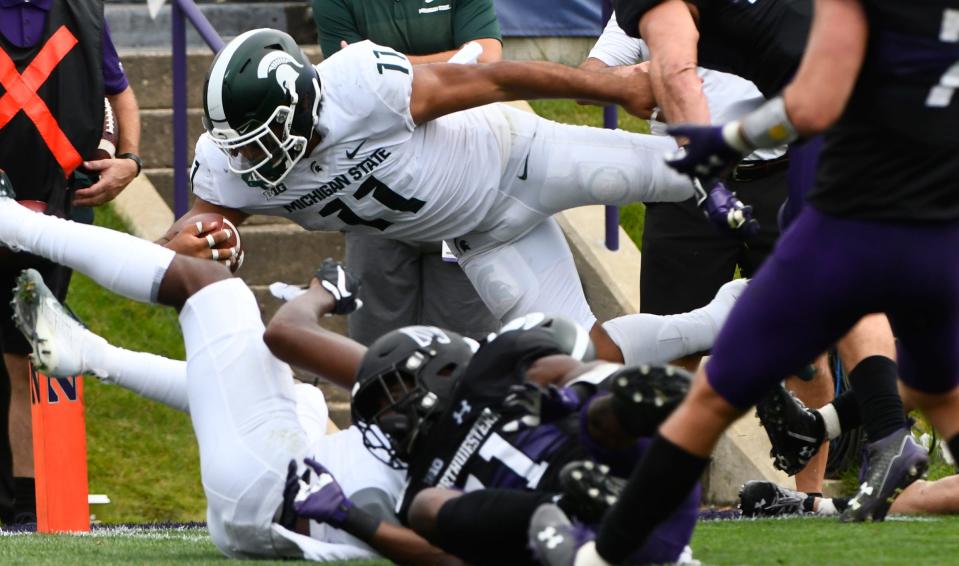 Michigan State running back Connor Heyward dives for the end zone against Northwestern during the second half Saturday, Sept. 21, 2019, in Evanston, Ill.