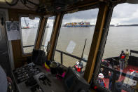 The site of the collapsed Francis Scott Key Bridge and the container ship that toppled it, Dali, are seen from a debris retrieval vessel, the Reynolds, April 4, 2024, in Baltimore. (Kaitlin Newman/The Baltimore Banner via AP)