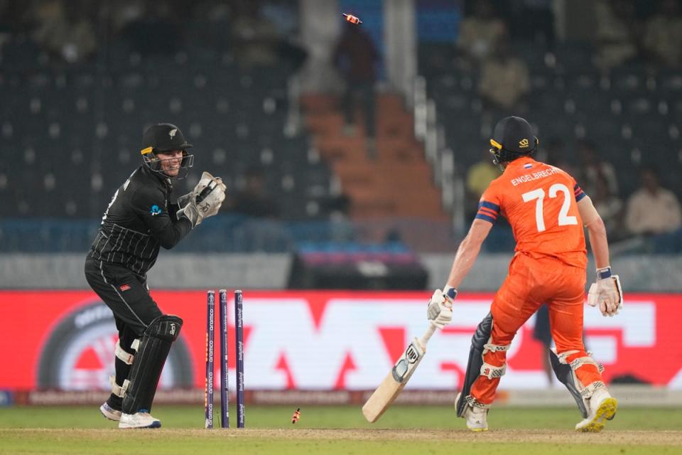 New Zealand’s wicketkeeper Tom Latham dislodges the bails to stump out Netherlands’ Sybrand Engelbrecht, which was deemed not out by the third umpire, during the ICC Men’s Cricket World Cup match between New Zealand and Netherlands in Hyderabad (AP)