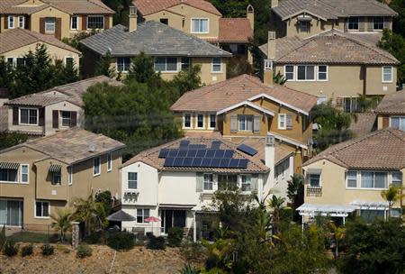 A home with solar panels on its roof is shown in a residential neighborhood in San Marcos, California September 19,2013. REUTERS/Mike Blake