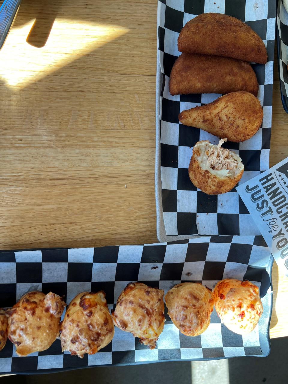 From the top, pastels are like an empanada. Coxinha is a fried dumpling stuffed with shredded chicken and cream cheese. Pao de queijo is a Brazilian bread baked with cheese inside. Eat all of them.