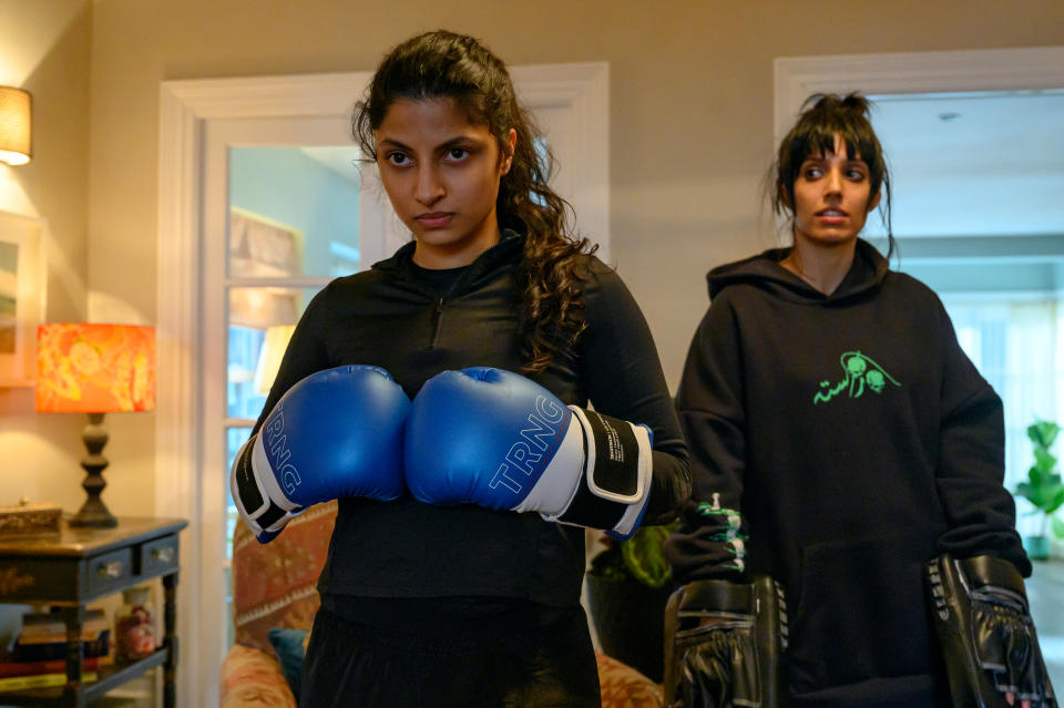 Priya Kansara stars as Ria Khan and Ritu Arya as her sister Lena in Polite Society. (Universal)