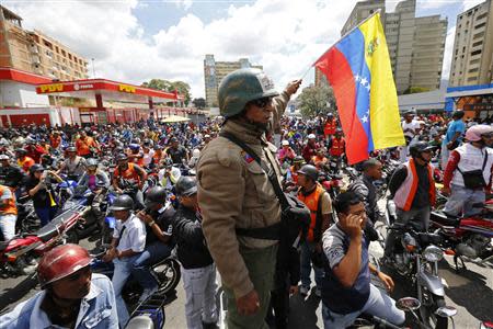 Motorcyclists take part in a protest against possible regulation and schedule bans as a measure to combat insecurity in Caracas January 31, 2014. REUTERS/Jorge Silva