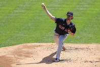 Cleveland Indians' Shane Bieber throws during the first inning of a baseball game against the Cincinnati Reds in Cincinnati, Sunday, April 18, 2021. (AP Photo/Aaron Doster)