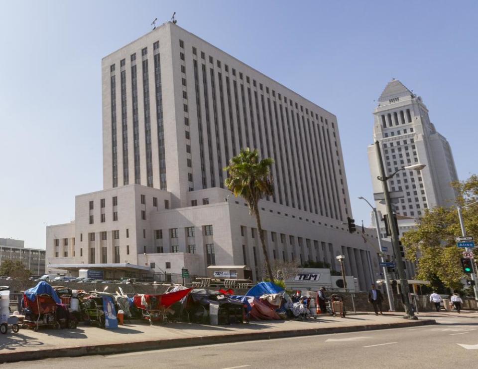 A homeless encampment lies in the shadow of the courthouse in downtown Los Angeles.