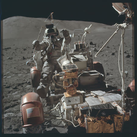 Scientist-astronaut Harrison H. Schmitt is photographed seated in the Lunar Roving Vehicle (LRV) at Station 9 (Van Serg Crater) during the third Apollo 17 extravehicular activity (EVA) at the Taurus-Littrow landing site during the Apollo 17 mission December 13, 1972. REUTERS/NASA/Handout
