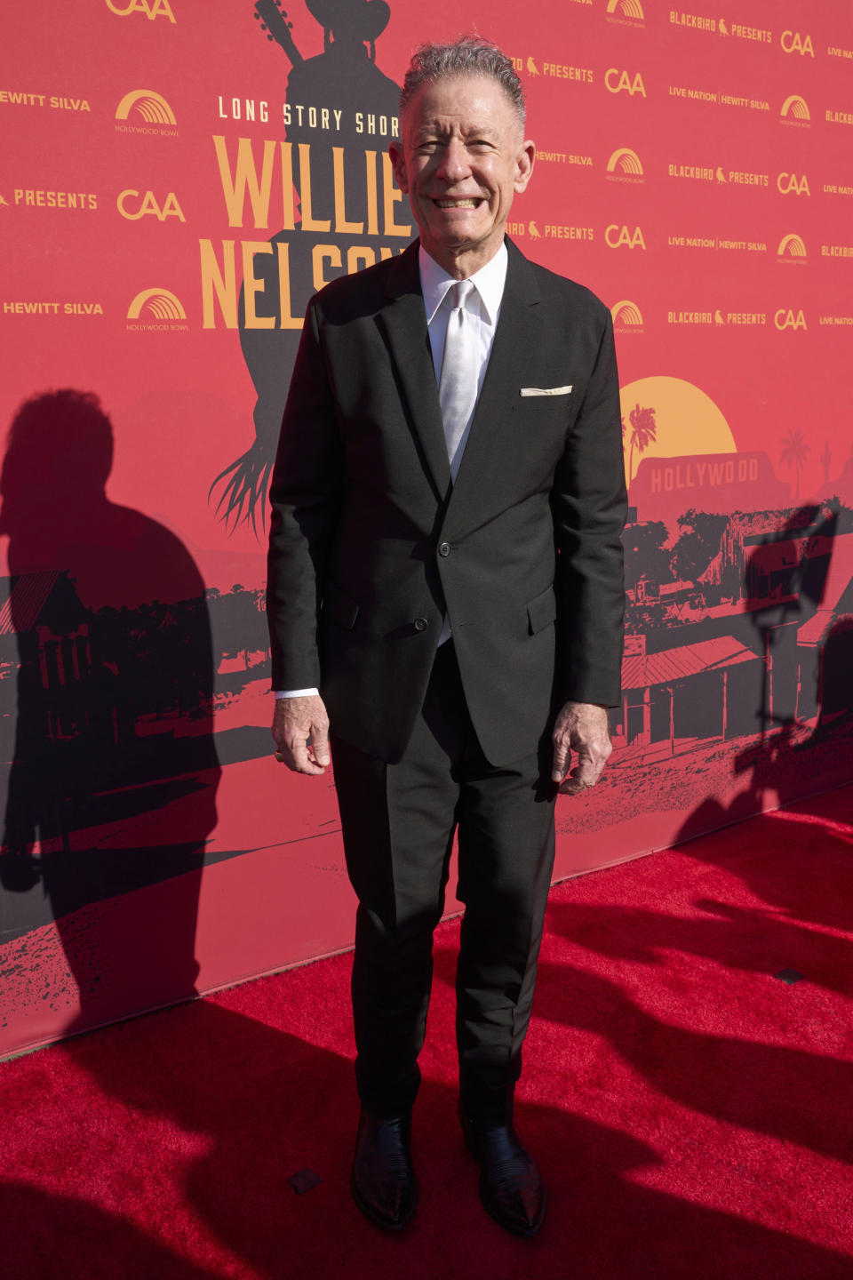 Lyle Lovett arrives at Willie Nelson 90, celebrating the singer's 90th birthday, on Saturday, April 29, 2023, at the Hollywood Bowl in Los Angeles. (Photo by Allison Dinner/Invision/AP)