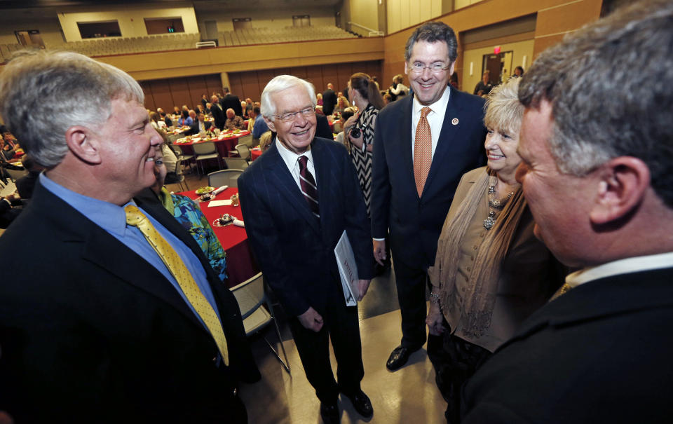 This photo taken Feb. 20, 2014 shows Sen. Thad Cochran, R-Miss., second from left, speaking to attendees of the City of Pearl's Chamber of Commerce Awards Banquet with Rep. Gregg Harper, R-Miss., in Pearl, Miss. Thad Cochran is engaged in his toughest campaign in a generation. The former Appropriations Committee chairman faces a June 3 primary challenge from a two-term state lawmaker. Chris McDaniel riles up tea party voters by denouncing big federal spending and portraying the 76-year-old incumbent as a Washington insider who’s lost touch with folks back home. (AP Photo/Rogelio V. Solis)