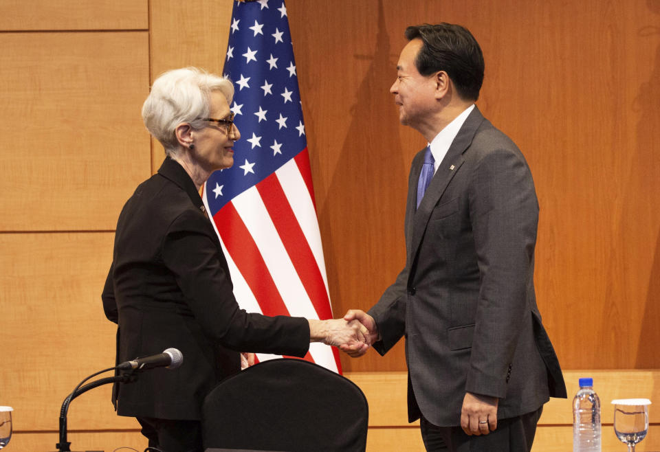 South Korea's First Vice Foreign Minister Cho Hyun-dong, right, shakes hands with U.S. Deputy Secretary of State Wendy Sherman, after a joint news conference at the Foreign Ministry in Seoul, South Korea, Wednesday, June 8, 2022. (Jeon Heon-Kyun/Pool Photo via AP)