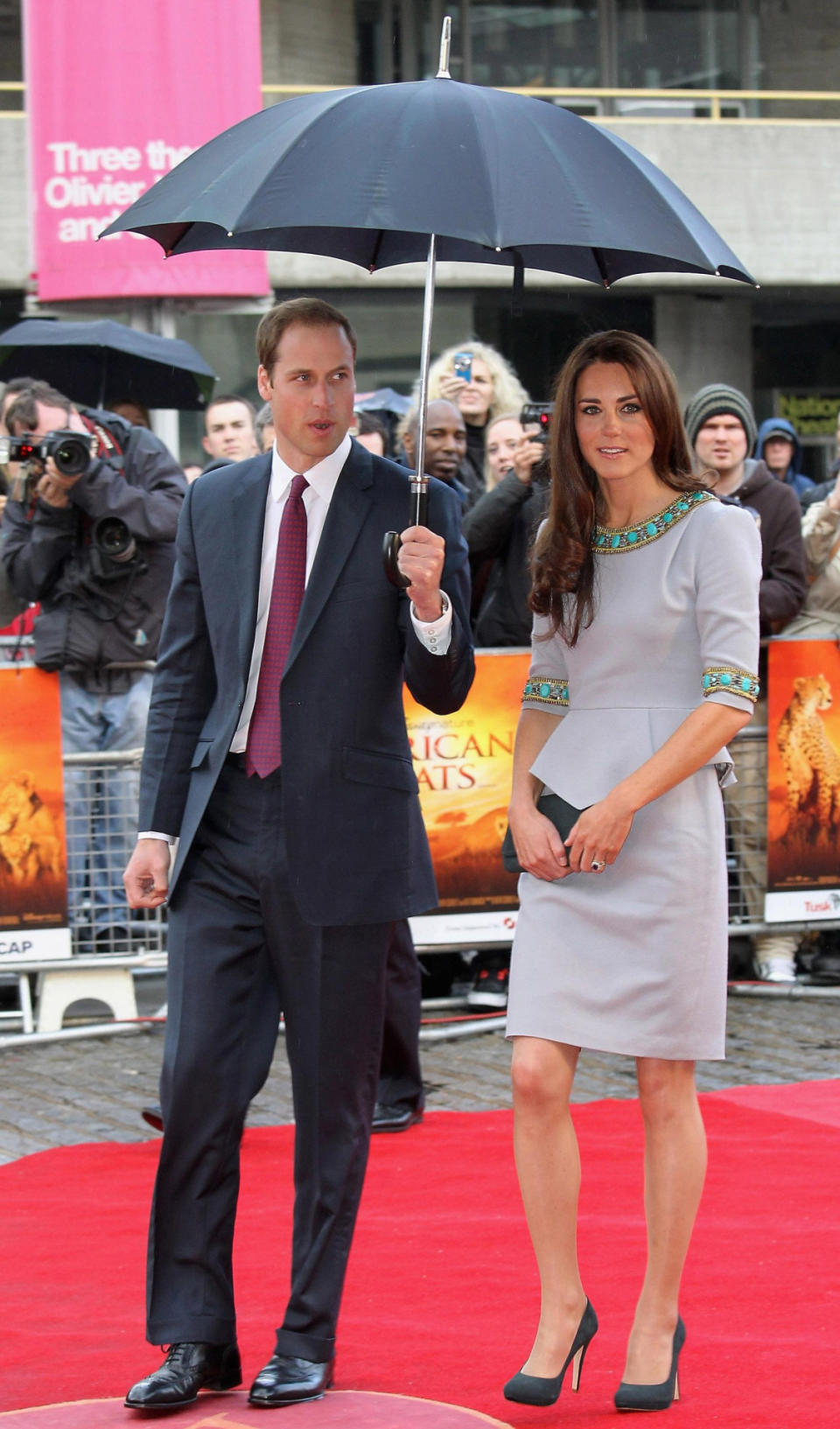 <p>The Duchess attended the UK premiere of <i>African Cats</i> in a beaded dress by Matthew Williamson. She paired the look with dark grey shoes and a matching clutch - both by Emmy London.</p><p><i>[Photo: PA]</i></p>