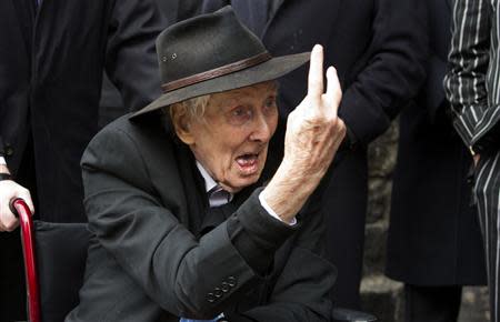 File photograph shows Great Train Robber Ronnie Biggs gesturing as he arrives for the funeral of Bruce Reynolds, at the church of St Bartholomew the Great in London March 20, 2013. REUTERS/Neil Hall/Files