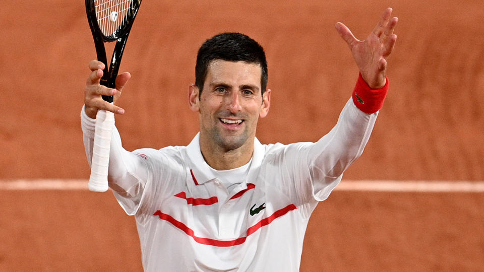 Novak Djokovic is pictured celebrating after winning against Colombia's Daniel Elahi Galan at the French Open. (Photo by ANNE-CHRISTINE POUJOULAT/AFP via Getty Images)