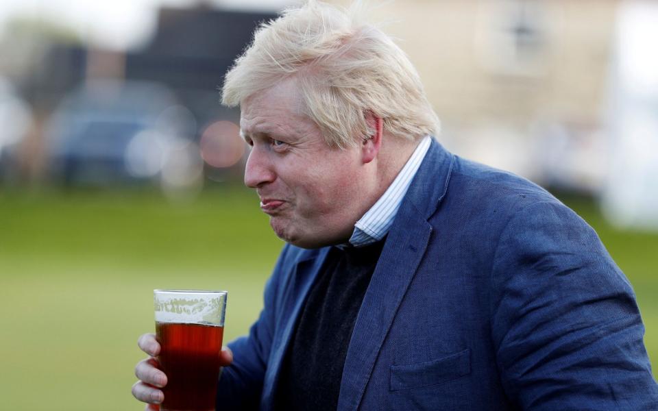 The Prime Minister, pictured drinking a beer in 2016, is making plans to cut obesity a priority - Phil Noble/Reuters