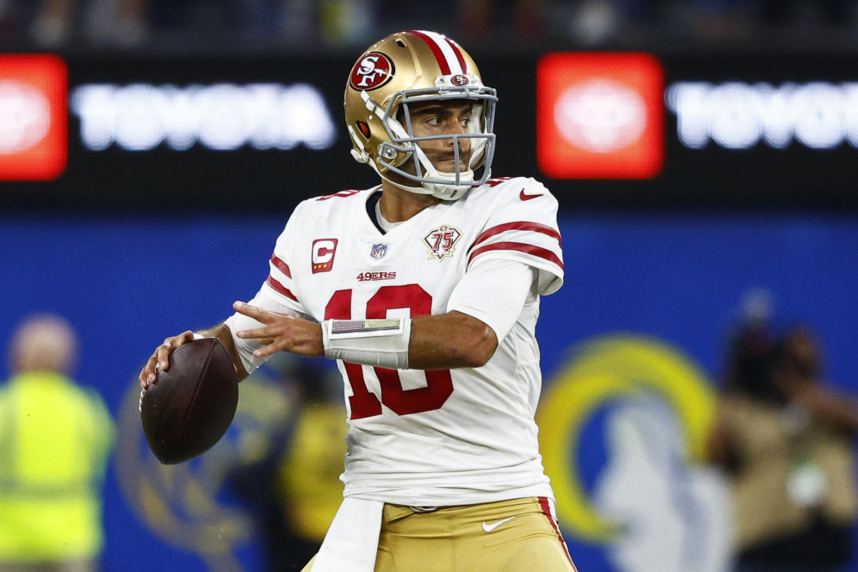 INGLEWOOD, CALIFORNIA - JANUARY 30: Jimmy Garoppolo #10 of the San Francisco 49ers looks to pass the ball in the NFC Championship Game against the Los Angeles Rams at SoFi Stadium on January 30, 2022 in Inglewood, California. (Photo by Ronald Martinez/Getty Images)