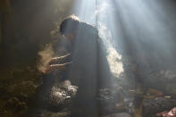 <p>A man washes his hands on Feb. 23, 2017 in Belgrade, Serbia. Migrants on a journey to Western Europe, mostly from war-torn Afghanistan and Pakistan take shelter in an abandoned building in Belgrade, Serbia. Many were returned to Serbia after being arrested in Hungary, complaining about violences from allegedly Hungarian police officers. (Photo: Pierre Crom/Getty Images) </p>