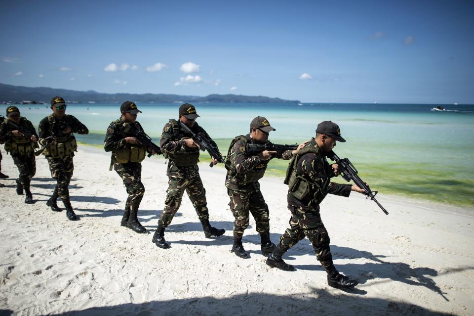 Policemen take part in a security measures exercise on the Philippine island of Boracay island on April 25, 2018.