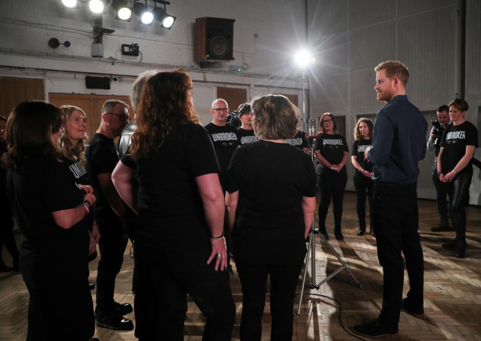 Britain's Prince Harry, Duke of Sussex chats with members of the Invictus Games Choir during his meeting with US singer Jon Bon Jovi at Abbey Road Studios in London on February 28, 2020