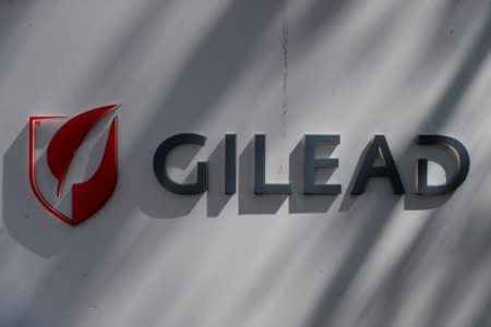 FILE PHOTO: A Gilead Sciences, Inc. logo is seen outside the company headquarters in Foster City, California, U.S. May 1, 2018. REUTERS/Stephen Lam/File Photo