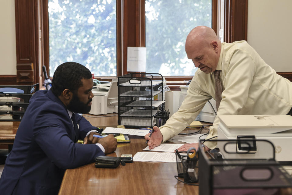 Attorney Christian Wise Smith files paperwork to qualify as a candidate for Fulton County District Attorney at the Georgia State Capitol, Friday, March 8, 2024, in Atlanta. Smith, who ran against Fani Willis four years ago, is challenging her in the May Democratic primary election. (Natrice Miller/Atlanta Journal-Constitution via AP)