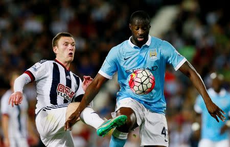 Football - West Bromwich Albion v Manchester City - Barclays Premier League - The Hawthorns - 10/8/15 Manchester City's Yaya Toure in action with West Brom's Craig Gardner Action Images via Reuters / Jason Cairnduff