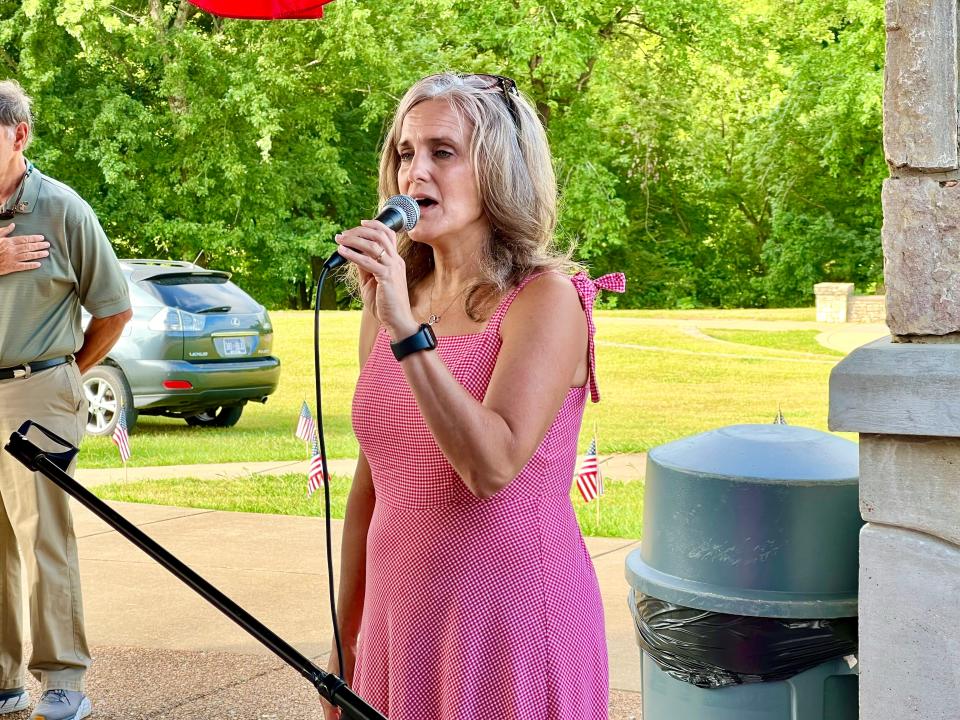 Jill Caldwell performs "The Star Spangled Banner" at the annual 4th of July celebration at Riverwalk Park.