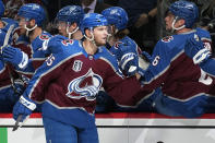 Colorado Avalanche left wing Andre Burakovsky is congratulated for his goal against the Tampa Bay Lightning during the first period in Game 2 of the NHL hockey Stanley Cup Final, Saturday, June 18, 2022, in Denver. (AP Photo/John Locher)
