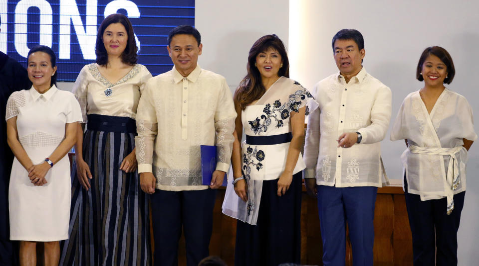 Six of the twelve newly-proclaimed senators pose following proclamation ceremony at the Commission on Elections in suburban Pasay city south of Manila, Philippines Wednesday, May 22, 2019. They are, from left, Senators Grace Poe, Pia Cayetano, Sonny Angara, Imee Marcos, Aquilino Pimentel and Nancy Binay. (AP Photo/Bullit Marquez)