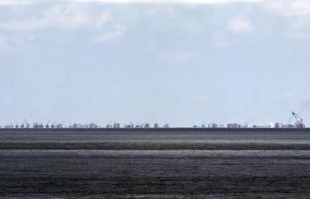 The alleged on-going land reclamation of China at Subi reef is seen from Pagasa island (Thitu Island) in the Spratlys group of islands in the South China Sea, west of Palawan, Philippines, May 11, 2015. REUTERS/Ritchie B. Tongo/Pool