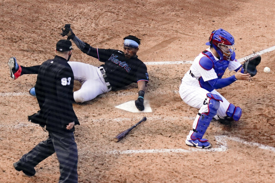 The Marlins slid past the Cubs in Game 2 of the NL wild-card series. (Photo by Nuccio DiNuzzo/MLB Photos via Getty Images)