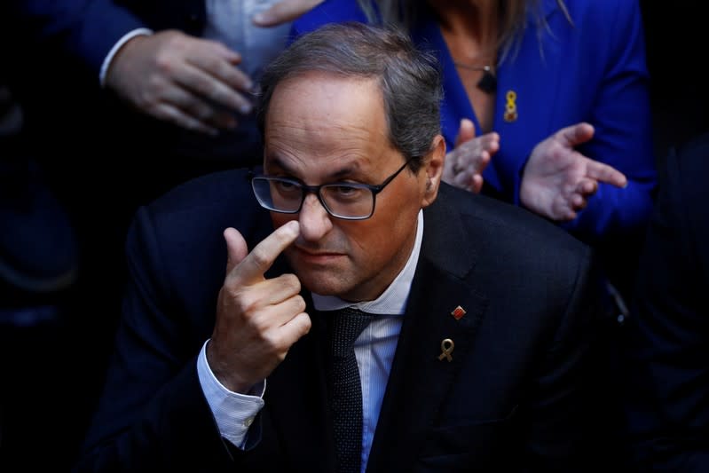 Catalan leader Quim Torra gestures as he meets with mayors of Catalonia region, at the Palau de la Generalitat in Barcelona