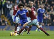 Chelsea's Willian (L) is challenged by West Ham United's Mark Noble during their English Premier League soccer match at Stamford Bridge in London, December 26, 2014. REUTERS/Stefan Wermuth