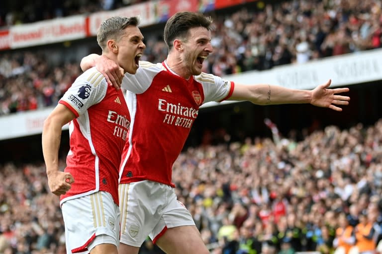 Arsenal's Leandro Trossard (L) and Declan Rice celebrate against Bournemouth (JUSTIN TALLIS)