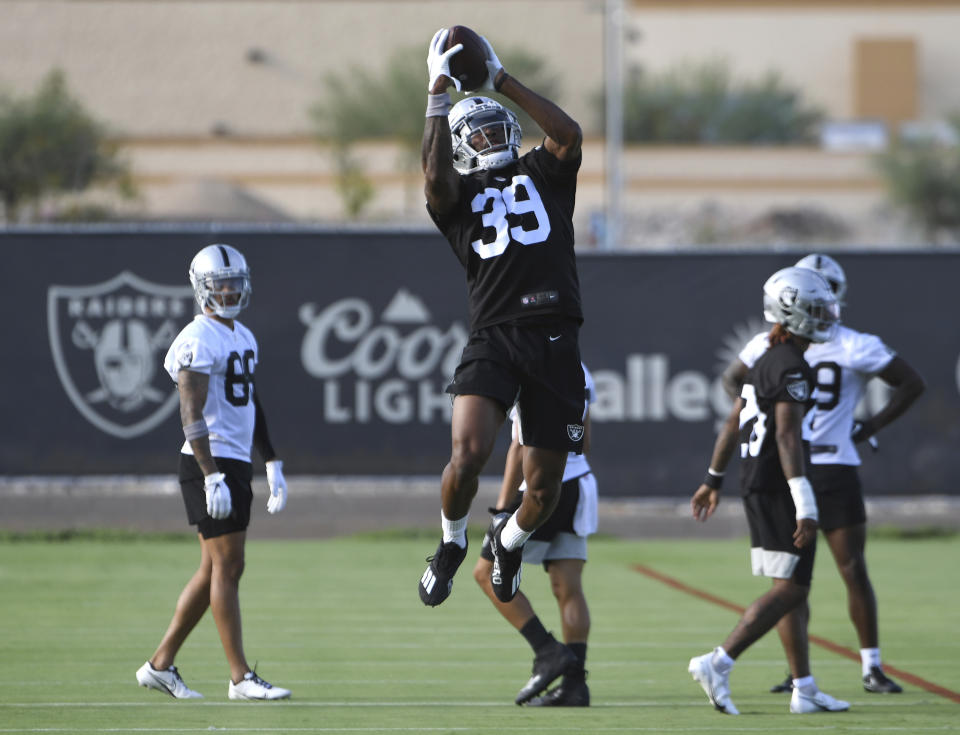 Las Vegas Raiders corner back Nate Hobbs (39) makes a catch during an NFL football practice Wednesday, July 28, 2021, in Henderson, Nev. (AP Photo/David Becker)