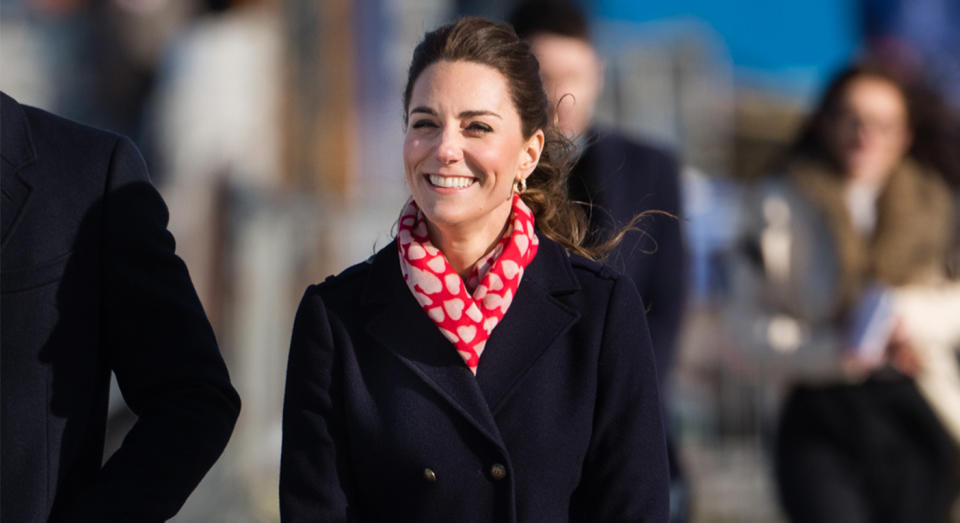 The Duchess of Cambrige wore a Hobbs coat and heart-adorned scarf in South Wales on Tuesday. [Photo: Getty]