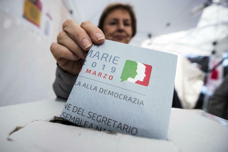 A woman casts her ballot to elect the new leader of the Italian Democratic Party, in Rome, Sunday, March 3, 2019. Rank-and-file Democrats in Italy were voting in a primary for a new leader, as the party tries to reverse slumping popularity. The balloting Sunday comes exactly a year after the badly squabbling Democratic Party leadership lost their hold on the government in national elections. (Angelo Carconi/ANSA via AP)