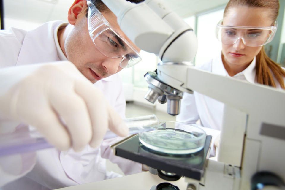 Scientists performing clinical research.