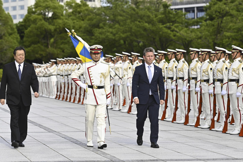 Sweden's Defense Minister Pal Jonson, right, reviews an honor guard, with Japan Defense Minister Yasukazu Hamada, left, ahead their bilateral meeting at the Defense Ministry Wednesday, June 7, 2023, in Tokyo, Japan. (David Mareuil/Pool Photo via AP)