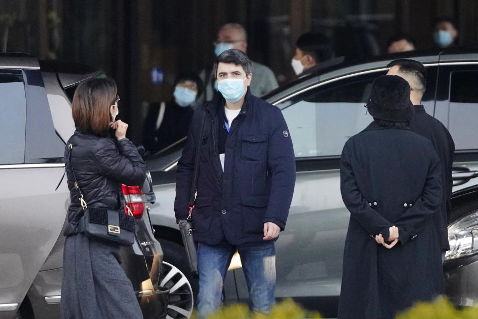 Vladmir Dedkov, center, of the World Health Organization team prepares to leave for a third day of field visit in Wuhan in central China's Hubei province on Sunday, Jan. 31, 2021. (AP Photo/Ng Han Guan)