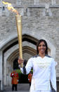 LONDON, ENGLAND - JULY 20: Dame Kelly Holmes poses with the torch at the Tower of London during the London 2012 Olympic Torch Relay on July 20, 2012 in London, England. The Olympic Flame is now on day 63 of a 70-day relay involving 8,000 torchbearers covering 8,000 miles. (Photo by Jan Kruger/Getty Images)