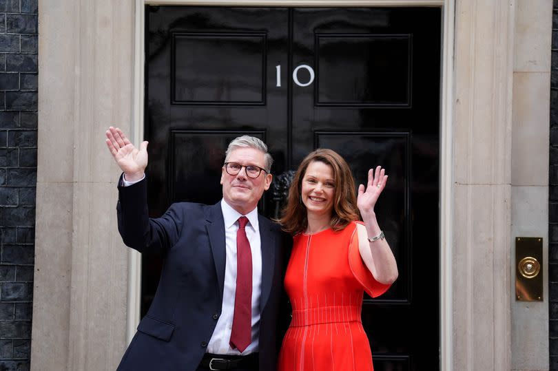 Sir Keir Starmer and his wife Victoria wave from outside Number 10 Downing Street