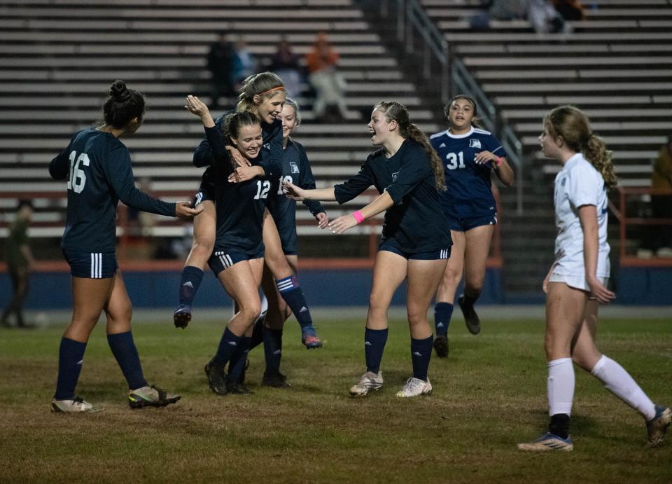 The Gators celebrate Jillian Thompson (12)'s penalty shot goal giving them a 2-0 lead during the Booker T. Washington vs Escambia girls soccer game at Escambia High School in Pensacola on Friday, Jan. 6, 2023.