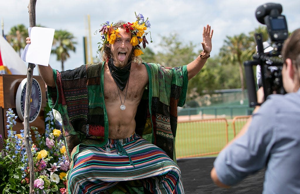 Deric Harvey of the New College of Florida shows the excitement of graduation at the commencement ceremony in 2021 in the open air of Ed Smith Stadium in Sarasota.