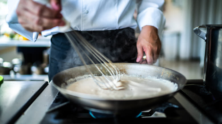 chef making cream sauce