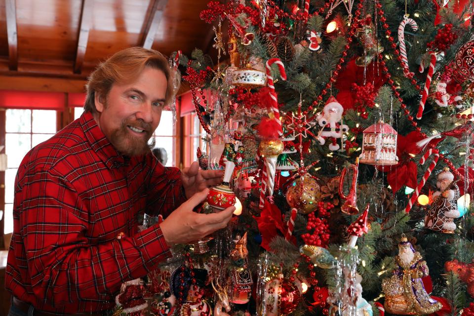 Since 1986, Putnam County resident Christopher Radko has been famous for his Christmas tree ornaments -- designed by him, and created by master glassblowers in Europe. This year he's designing ornaments under a new brand, HeARTfully Yours. Christopher Radko holds one of his favorites, the Hampton Court nutcracker ornament, at home Dec. 12, 2022. 