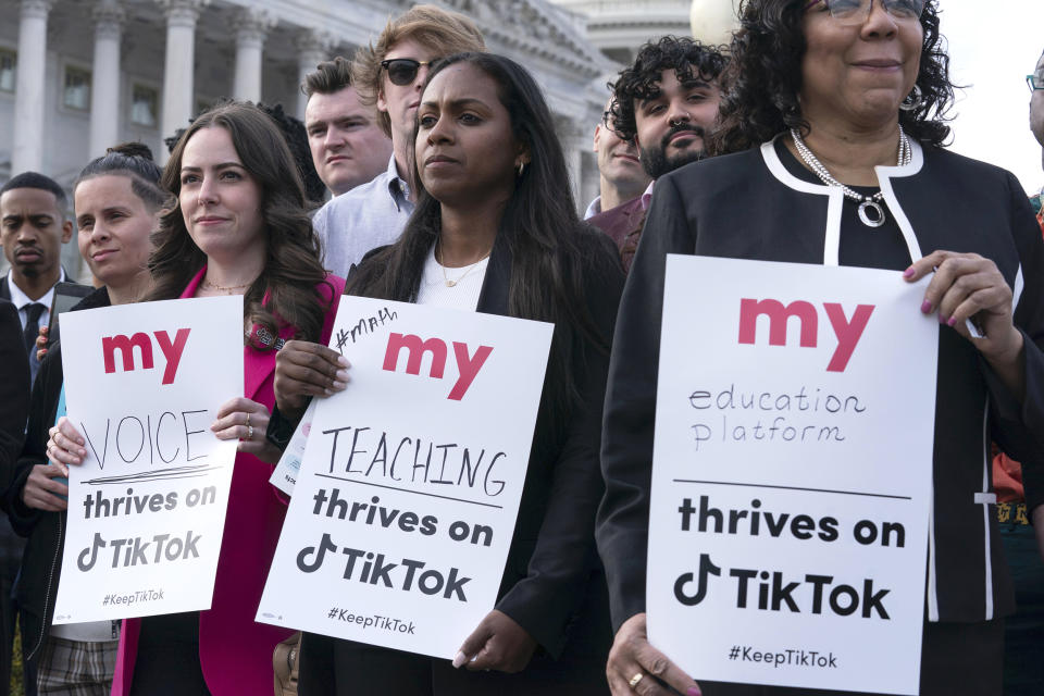 Supporters of TikTok hold signs during a rally to defend the app at the Capitol in Washington, Wednesday, March 22, 2023. The House holds a hearing Thursday, with TikTok CEO Shou Zi Chew about the platform's consumer privacy and data security practices and impact on kids. (Jose Luis Magana / AP)