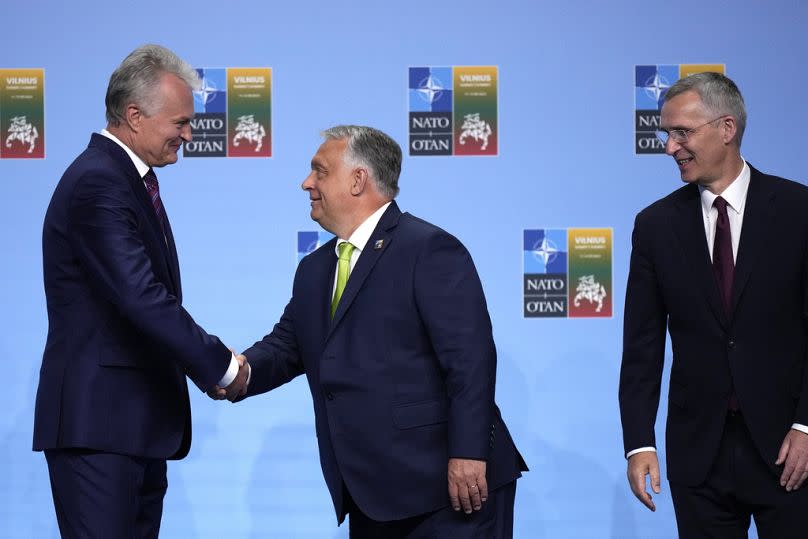 NATO Secretary General Jens Stoltenberg and Lithuania&apos;s President Gitanas Nauseda greet Hungary&apos;s PM Viktor Orban at a NATO summit in Vilnius, July 2023